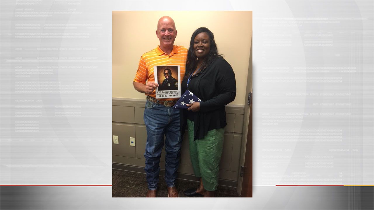 Runner Presents Flag To Fallen OKC Officer's Widow